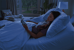 A woman looking at her Sleeptracker app