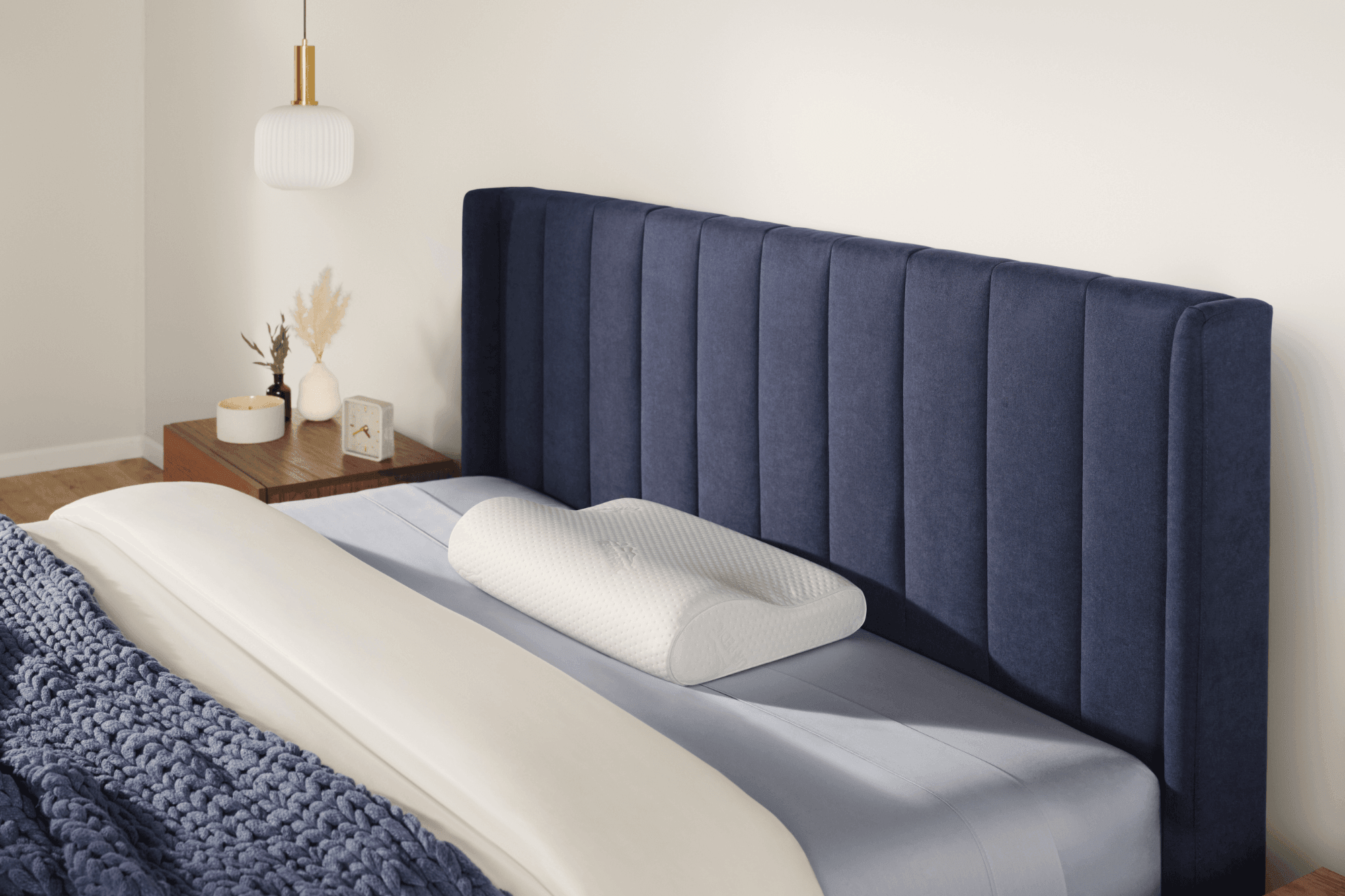 Neck pillow on dressed bed