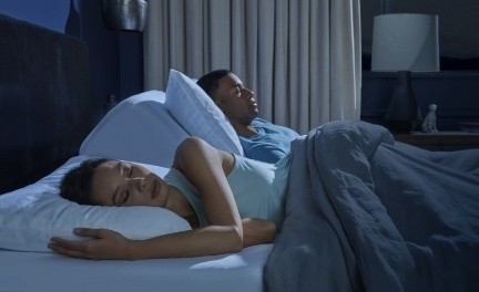 Couple asleep on an adjustable base