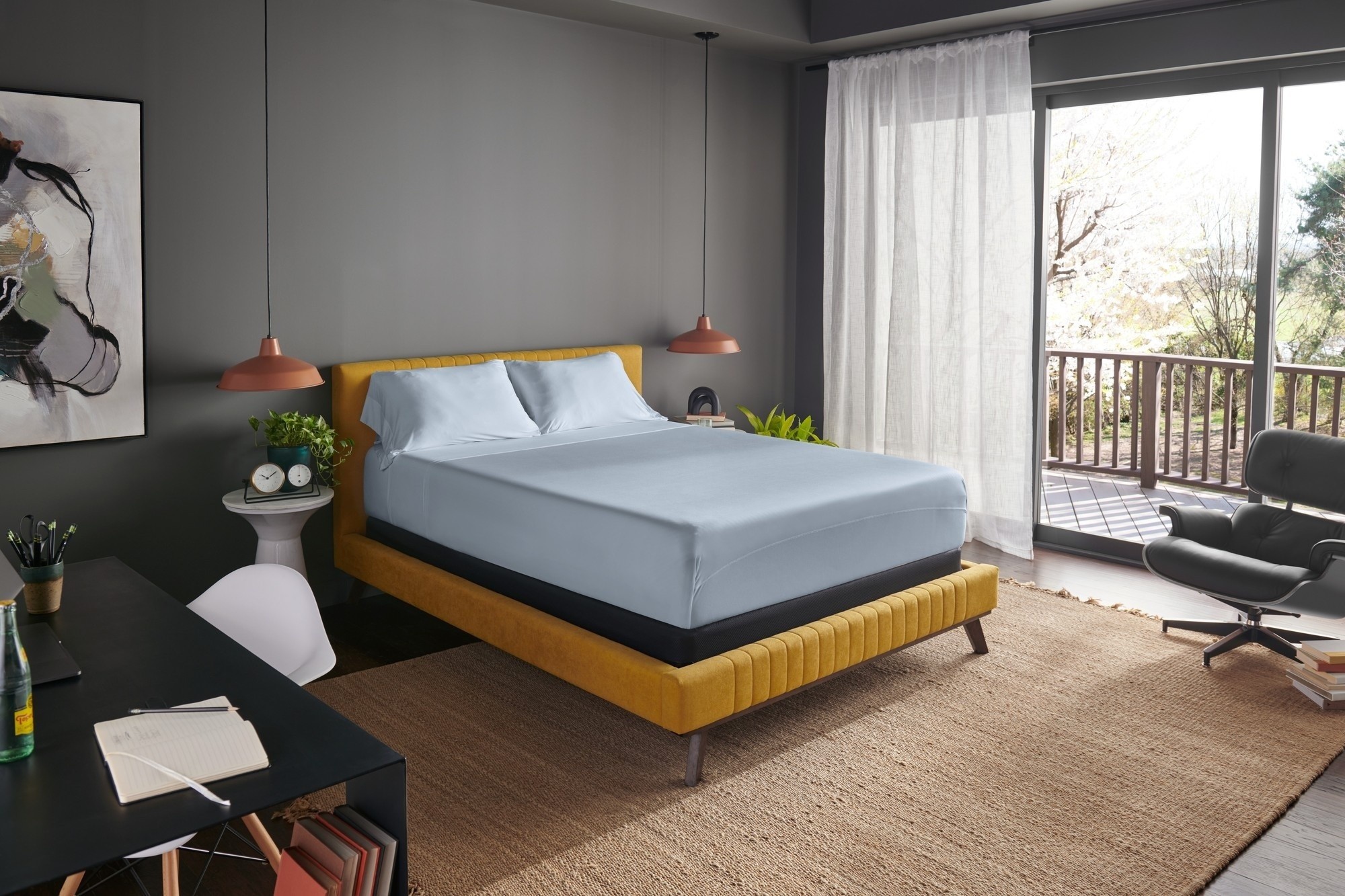 mattress in a styled room with sleepy blue sheets